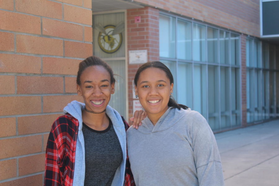 President Shanice Robertson and Vice President Ashley Smith smile in front of Blake High School